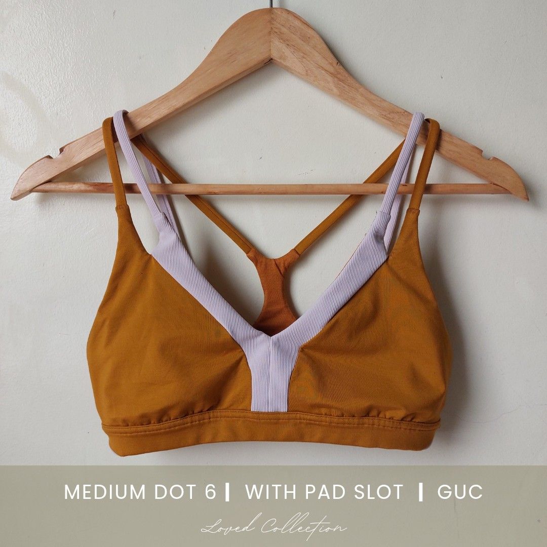 Lululemon Sports bra l (Category: Activewear) located in Quezon City. Submitted by lovedcollection_2020 (Listing ID 1469166457, Image 1). Description: - Brand: Lululemon - Features: Includes pad slots for customizable support - Condition: Well maintained, with a minor pinkish color transfer spot on the ribbed back band near the stitching.