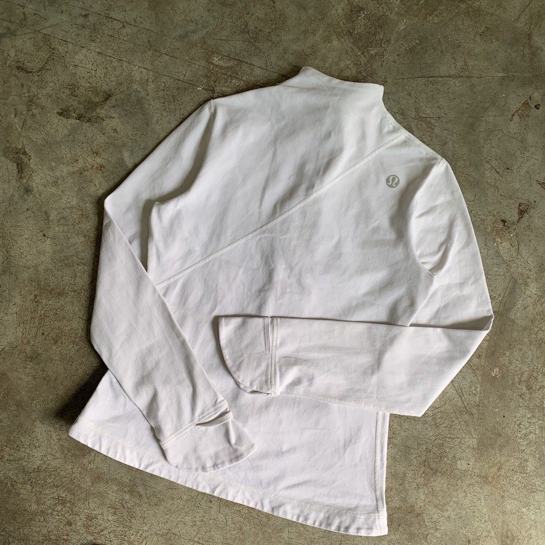Lululemon White Zip Up Jacket (Category: Coats, Jackets and Outerwear) located in Manila. Submitted by emplysthrift. (Listing ID 1469230594, Image 2). Description: Width "17 Length "23 Good Condition Colorrate: 9/10 Flaws: minor dirtstains Unli vouch/vc for safe transactions 📲 Location: Laspinas City, Metro Manila, Brngy Talon Uno. 📍 DM IF INTERESTED📥 - Brand: Lululemon - Color: White - Style: Athletic zip-up jacket with mock neck and diagonal