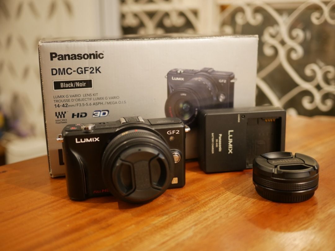 Lumix GF2 + Lumix 20mm (Category: Cameras) located in Pasig City. Submitted by jonddg (Listing ID 1469218488, Image 1). Description: - Panasonic Lumix DMC-GF2 camera w/ Lumix 20mm F1.7 + Rockstar 10mm - Vintage mirrorless camera in excellent condition - can produce film-like photos - touch screen (not as responsive as modern cameras), all buttons working, w/ working flash - Price is negotiable - Very compact, perfect for travel/street photography