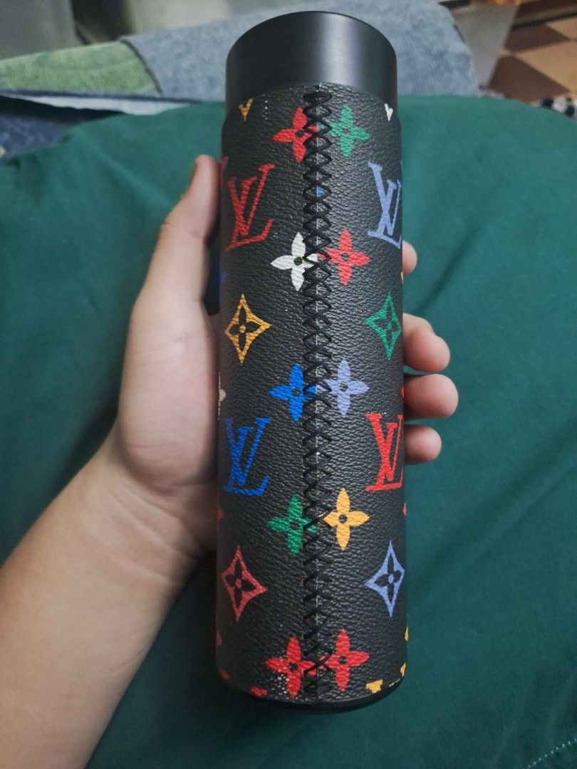 LV thermo tumbler (Category: Water Bottles & Tumblers) located in Manila. Submitted by ags028705 (Listing ID 1469287893, Image 2). Description: - Trendy black insulated tumbler with a vibrant multicolored monogram leather-look wrap - Durable stainless steel interior keeps beverages hot or cold for hours - Spotless interior with absolutely no residue, stains, or marks - Standard cylindrical design fits easily in most car and gym cup holders - Perf