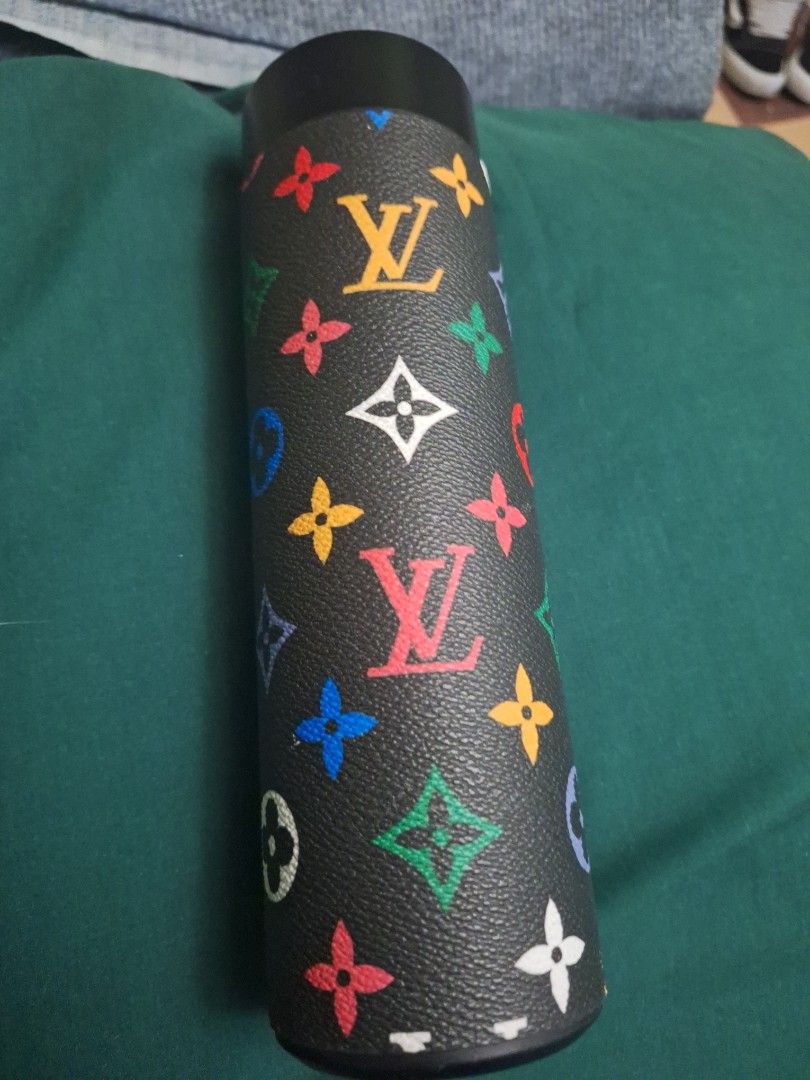 LV thermo tumbler (Category: Water Bottles & Tumblers) located in Manila. Submitted by ags028705 (Listing ID 1469287893, Image 1). Description: - Trendy black insulated tumbler with a vibrant multicolored monogram leather-look wrap - Durable stainless steel interior keeps beverages hot or cold for hours - Spotless interior with absolutely no residue, stains, or marks - Standard cylindrical design fits easily in most car and gym cup holders - Perf