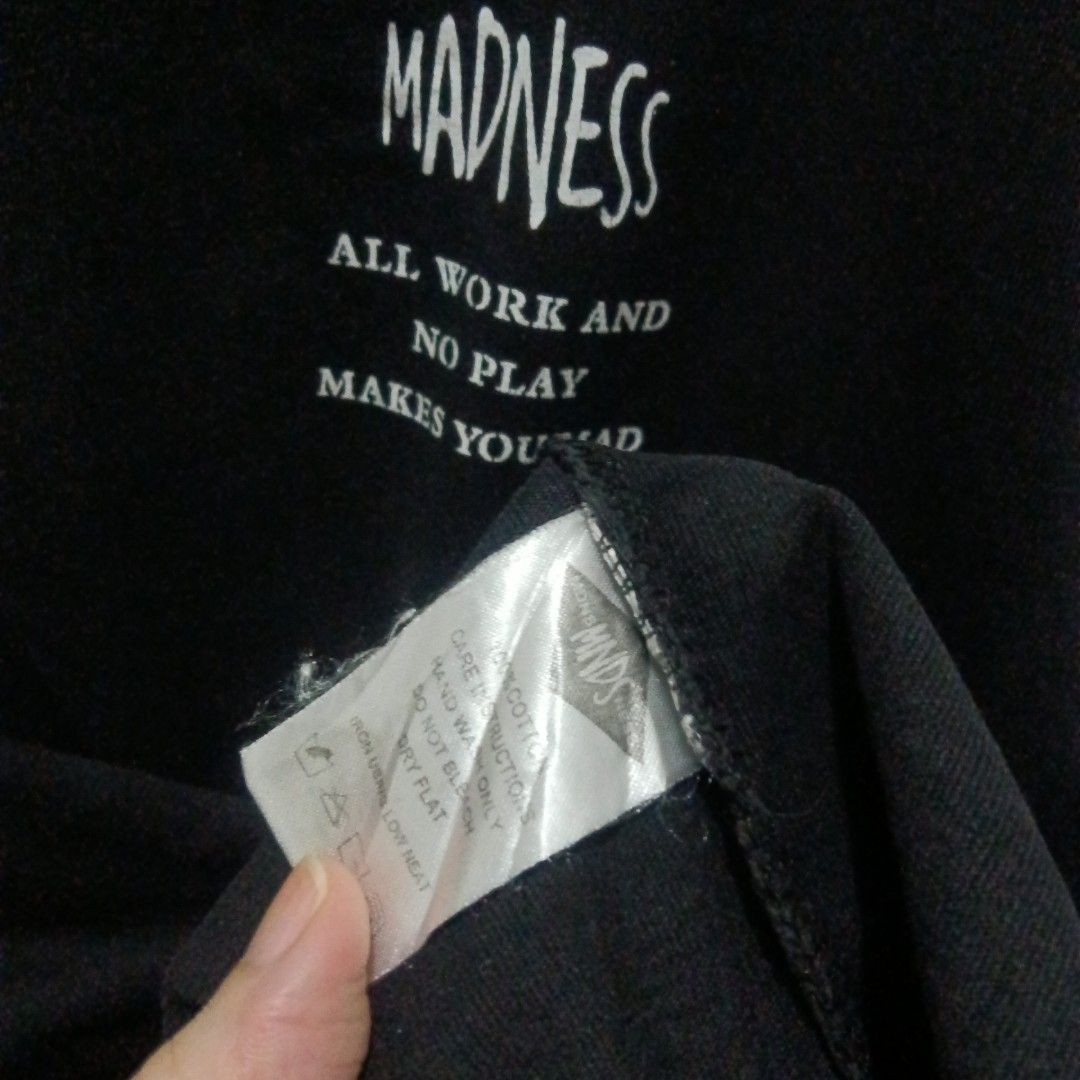 MADNESS Graphic Tee (Category: Tshirts & Polo Shirts ) located in Caloocan City. Submitted by jaychingsss (Listing ID 1469338025, Image 3). Description: Madness Graphic Tee - 100 22x29 Color Rate: 9.5/10 Makapal Tela minor issue: may few hairlines sa print NEED WASH.