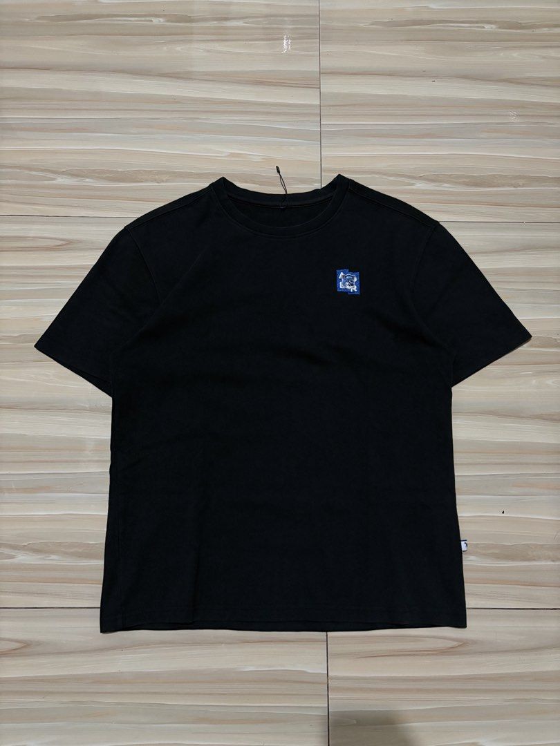 Maison Kitsune Black T-Shirt with Patch (Category: Shirts) located in Ajuy. Submitted by reeyn0515 (Listing ID 1469325960, Image 1). Description: - 21x27 - Brand: Maison Kitsuné - Condition: Brand new with tags (BNWT) - Color: Classic black - Material: Premium cotton - Features: Blue and white embroidered chest patch, small back shoulder logo patch, side hem fabric tag - Fit/Style: Short-sleeve, crewneck, comfortable everyday fit.