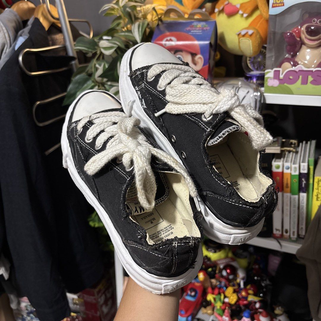 Maison Mihara Yasuhiro Black Low Top Sneakers (Category: Sneakers) located in Caloocan City. Submitted by bonsatocha43876 (Listing ID 1469312701, Image 2). Description: - Brand: Maison Mihara Yasuhiro - Color/Material: Classic black canvas - Design: Distinctive chunky distorted white sole, thick cream laces, and edgy raw frayed details - Condition: Very good overall - Price: ₱1,900 only.