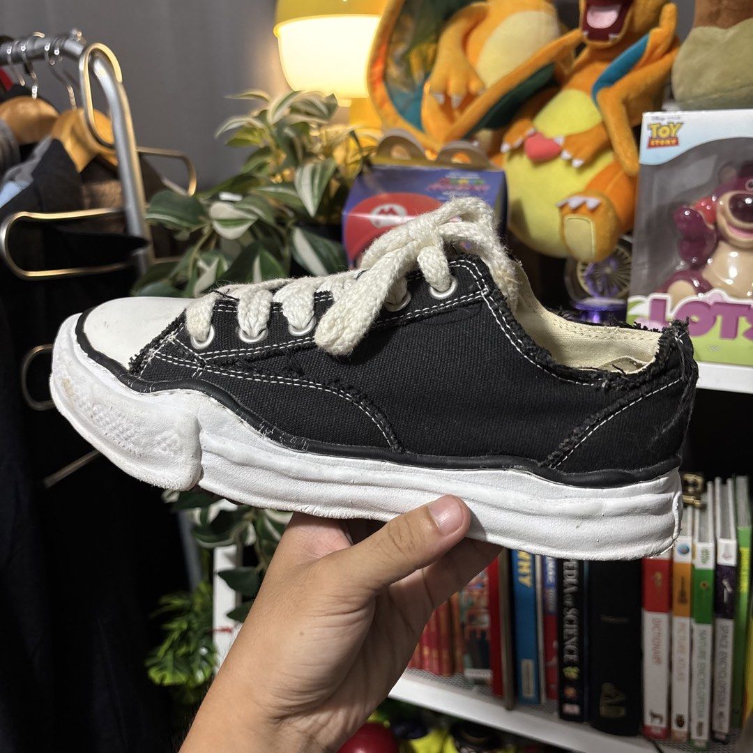 Maison Mihara Yasuhiro Black Low Top Sneakers (Category: Sneakers) located in Caloocan City. Submitted by bonsatocha43876 (Listing ID 1469312701, Image 3). Description: - Brand: Maison Mihara Yasuhiro - Color/Material: Classic black canvas - Design: Distinctive chunky distorted white sole, thick cream laces, and edgy raw frayed details - Condition: Very good overall - Price: ₱1,900 only.