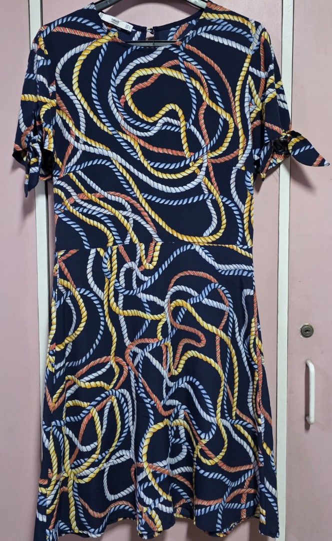 Mango dress (Category: Dresses) located in Manila. Submitted by esamd (Listing ID 1469325363, Image 1). Description: MANGO Size: Small Short-sleeved navy blue day dress featuring an all-over multicolored rope and swirl print, a crew neckline, and tie details on the sleeves.