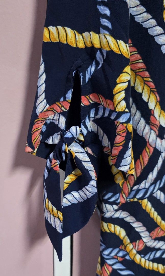 Mango dress (Category: Dresses) located in Manila. Submitted by esamd (Listing ID 1469325363, Image 3). Description: MANGO Size: Small Short-sleeved navy blue day dress featuring an all-over multicolored rope and swirl print, a crew neckline, and tie details on the sleeves.