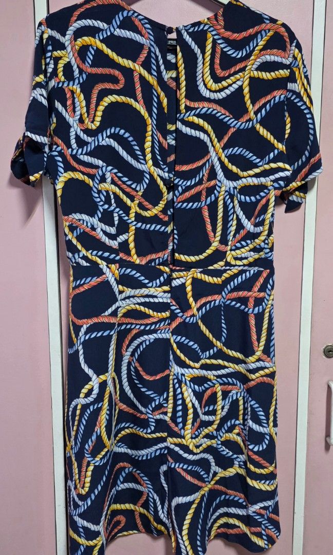 Mango dress (Category: Dresses) located in Manila. Submitted by esamd (Listing ID 1469325363, Image 2). Description: MANGO Size: Small Short-sleeved navy blue day dress featuring an all-over multicolored rope and swirl print, a crew neckline, and tie details on the sleeves.