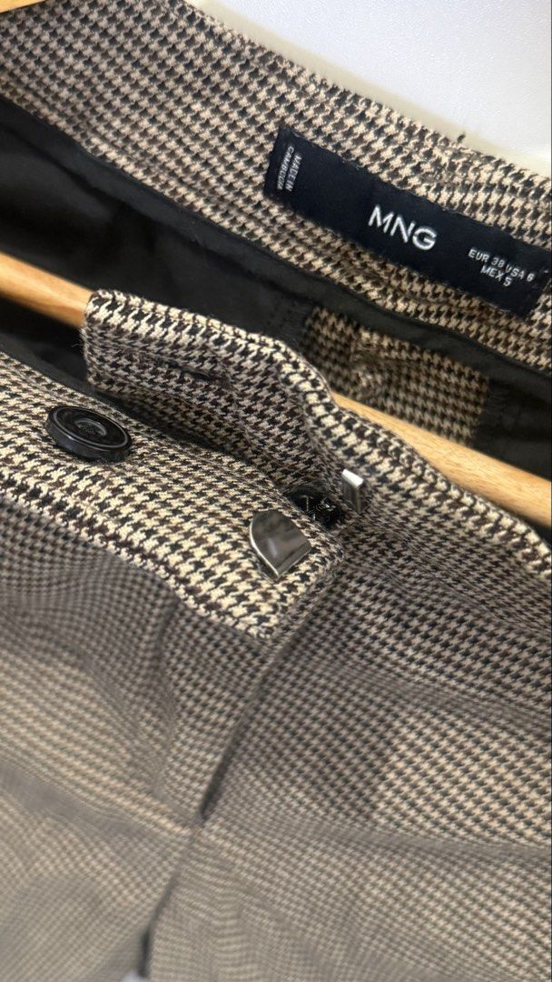 Mango Office Pants in Brown (Category: Other Bottoms) located in Pasig City. Submitted by riveraflows3 (Listing ID 1469218573, Image 3). Description: Size: EUR 38 / USA 6 / MEX 5 Pattern: Classic brown houndstooth Details: Structured waistband, zip fly with button closure, functional side pockets, and clean back pockets Fit: Tailored cut Condition: Well-used RFS: Decluttering.
