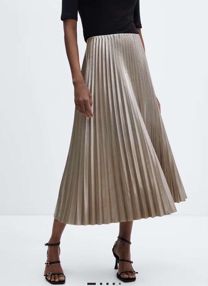 Mango pleated satin skirt (Category: Skirts) located in Makati City. Submitted by prelovedbystella16 (Listing ID 1469284129, Image 3). Description: Worn 2x only and stored Good as new condition no issue Size small, fits up to size medium No pockets unfortunately Satin material, no need to iron. Wash and wear.