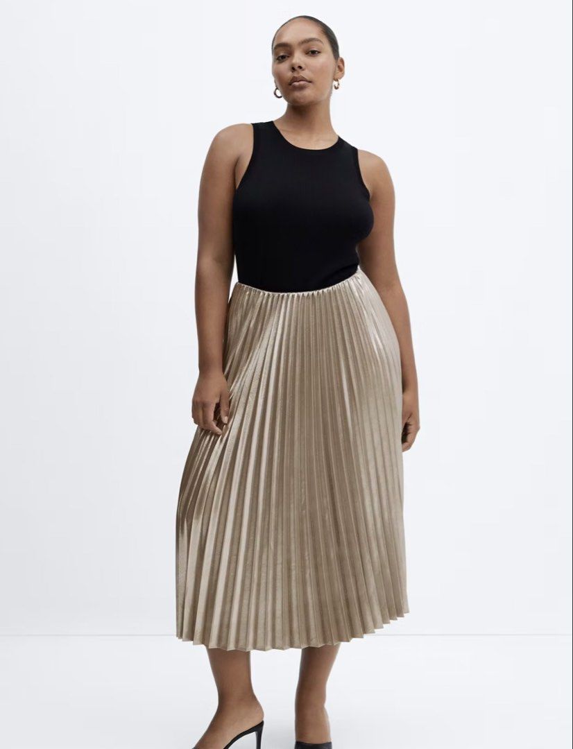 Mango pleated satin skirt (Category: Skirts) located in Makati City. Submitted by prelovedbystella16 (Listing ID 1469284129, Image 2). Description: Worn 2x only and stored Good as new condition no issue Size small, fits up to size medium No pockets unfortunately Satin material, no need to iron. Wash and wear.