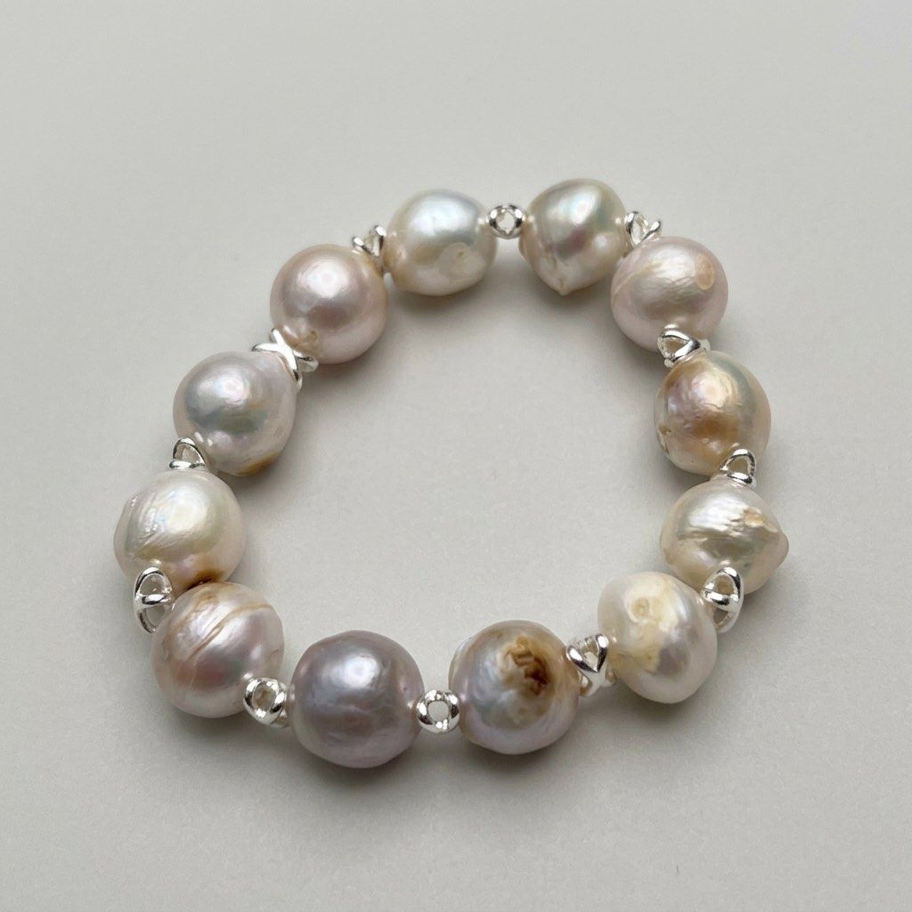 Manta Pearl Bracelet (Category: Bracelets) located in Lipa City. Submitted by avenueusco_ph (Listing ID 1469285532, Image 1). Description: Manta Pearl in bluish luster. Not perfectly round, with visible growth color and uneven surface but the luster is perfect. ✨✨ 12-13mm pearl size.