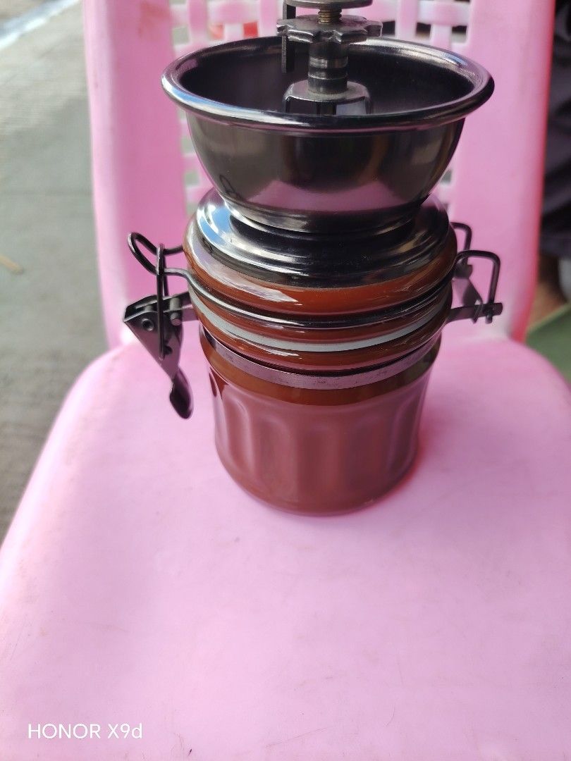 Manual Coffee Grinder with Glass Jar (Category: Coffee Machines & Makers) located in Manila. Submitted by mightypenguin_44c1b5 (Listing ID 1469209494, Image 2). Description: Hand-crank coffee grinder with adjustable settings, a durable metal mechanism, and a vintage brown glass jar. Perfect for fresh coffee at home or on camping trips..