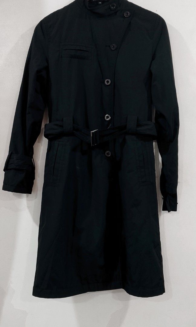 Marc Jacobs black trench coat (Category: Coats, Jackets and Outerwear) located in Cabanatuan. Submitted by miss.maia (Listing ID 1469297313, Image 2). Description: This Marc Jacobs black trench coat features a classic mid-length silhouette, a high stand collar, a belted waist, and button-up front closures..