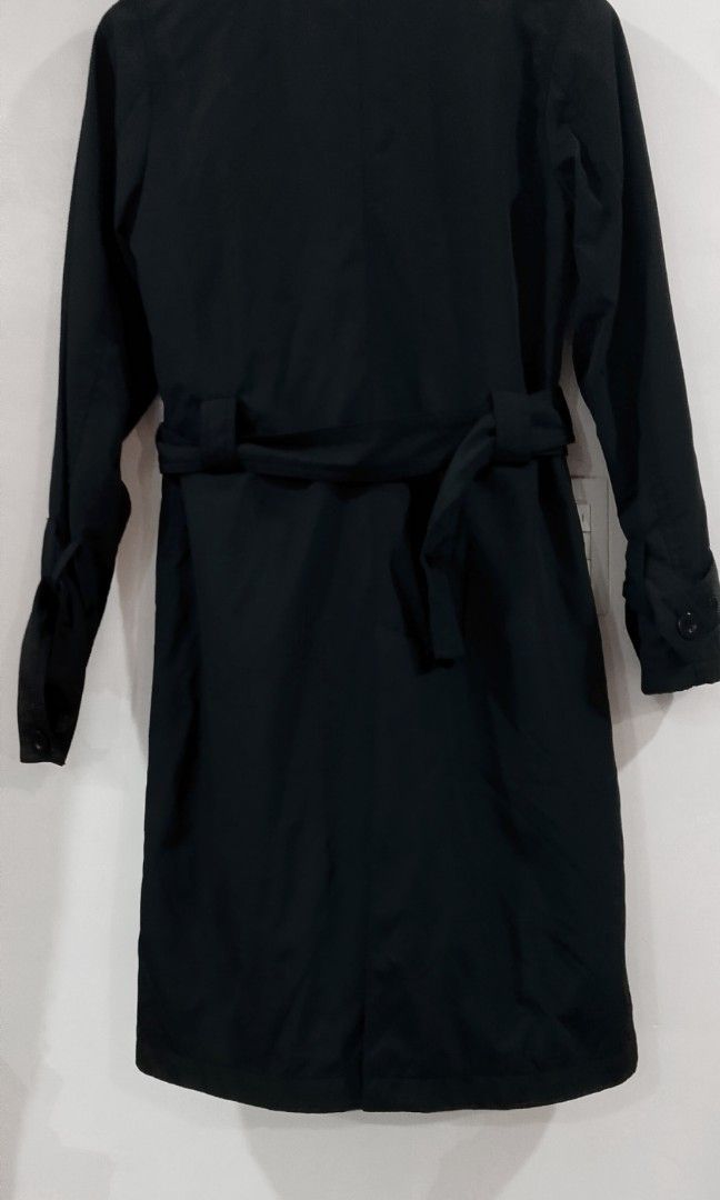 Marc Jacobs black trench coat (Category: Coats, Jackets and Outerwear) located in Cabanatuan. Submitted by miss.maia (Listing ID 1469297313, Image 3). Description: This Marc Jacobs black trench coat features a classic mid-length silhouette, a high stand collar, a belted waist, and button-up front closures..