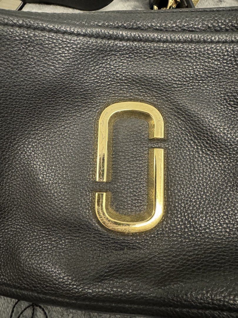 Marc Jacobs The Softshot 27 Black (Category: Luxury Bags & Wallets) located in Taguig. Submitted by sqaumejada (Listing ID 1469177493, Image 1). Description: - Brand: Marc Jacobs - Model: The Softshot 27 - Material: Soft pebble leather in classic black - Hardware: Elegant gold-tone - Compartments: Double zip design with interior card slots - Condition: Brand new with original tag attached - Inclusions: Brand card and dust pouch included.