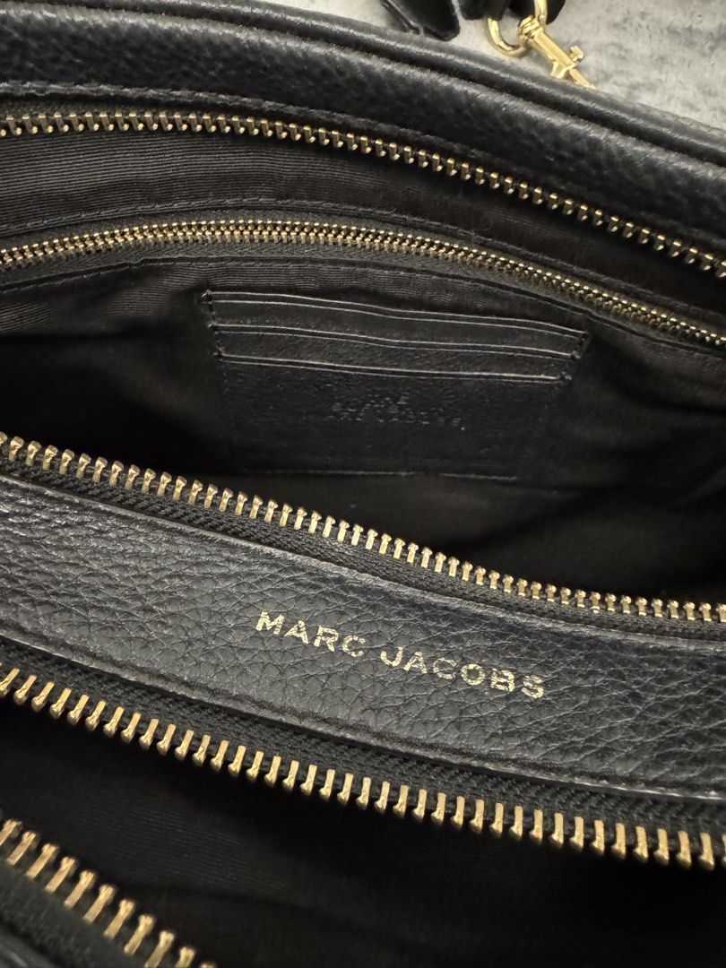Marc Jacobs The Softshot 27 Black (Category: Luxury Bags & Wallets) located in Taguig. Submitted by sqaumejada (Listing ID 1469177493, Image 3). Description: - Brand: Marc Jacobs - Model: The Softshot 27 - Material: Soft pebble leather in classic black - Hardware: Elegant gold-tone - Compartments: Double zip design with interior card slots - Condition: Brand new with original tag attached - Inclusions: Brand card and dust pouch included.