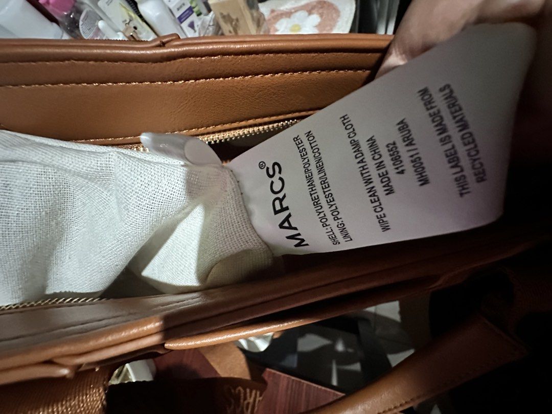 Marcs Aruba Tan Tote Bag with Branded Strap (Category: Tote Bags) located in Quezon City. Submitted by lableeyy (Listing ID 1469166926, Image 2). Description: Decluttering! 👜 FOR SALE: Marcs Aruba Tote Bag in Tan 🇦🇺 Pasabuy from Australia ✨ As in new, never been used! • No tags • Replacement dust bag included • Brown canvas with leather-look handles • Zip-top closure + detachable crossbody strap 📏 Dimensions: 35.5x15x25.5cm PM me if intereste