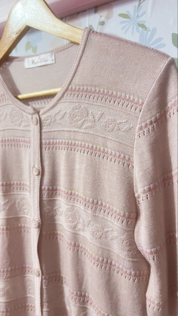 Marisa Grace Pink Knit Cardigan Size M (Category: Coats, Jackets and Outerwear) located in Pasig City. Submitted by morilove (Listing ID 1469186830, Image 3). Description: - Brand: Marisa Grace - Size: Medium - Color: Pink - Style: Button-up cardigan with crew neckline and long sleeves - Design: Detailed woven floral pattern across the chest, sleeves, and body with ribbed texture strips - Fabric: Lightweight knit - Condition: Excellent, clean inn