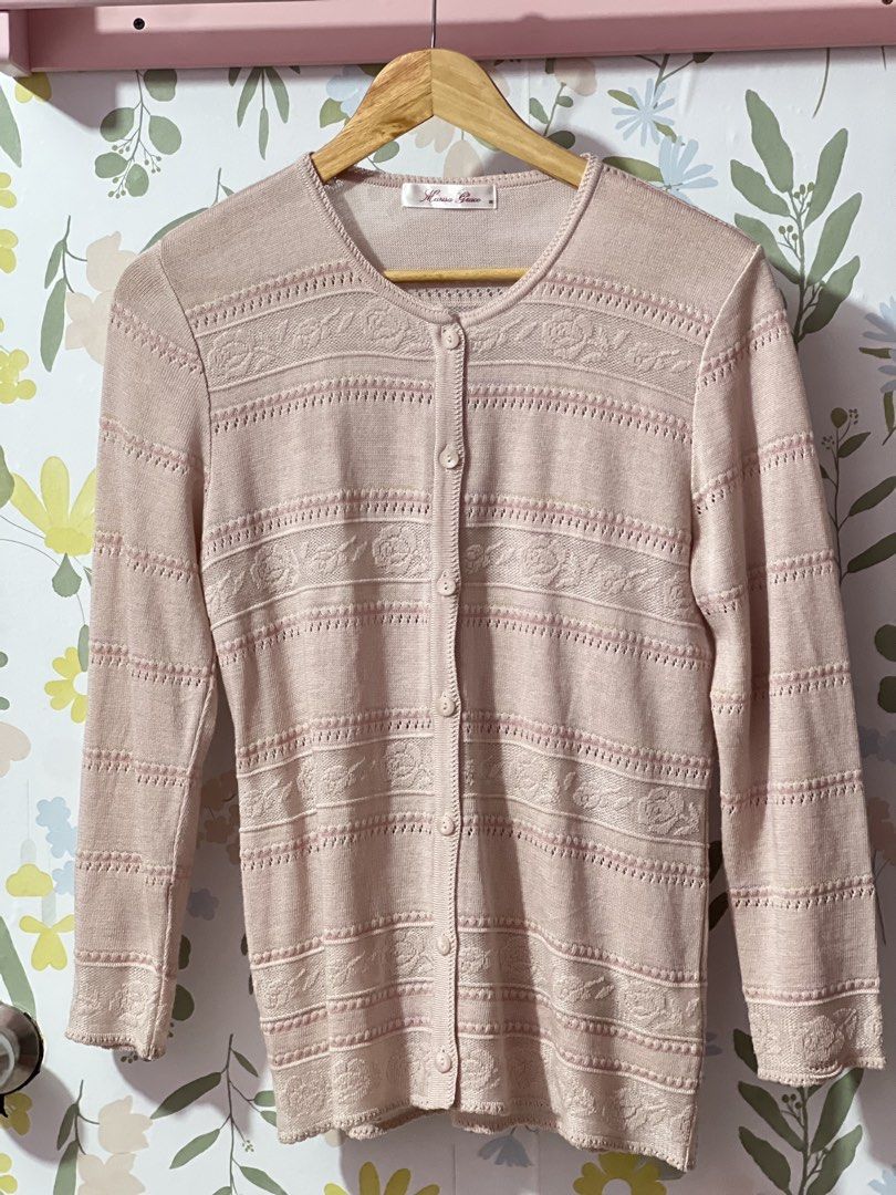 Marisa Grace Pink Knit Cardigan Size M (Category: Coats, Jackets and Outerwear) located in Pasig City. Submitted by morilove (Listing ID 1469186830, Image 1). Description: - Brand: Marisa Grace - Size: Medium - Color: Pink - Style: Button-up cardigan with crew neckline and long sleeves - Design: Detailed woven floral pattern across the chest, sleeves, and body with ribbed texture strips - Fabric: Lightweight knit - Condition: Excellent, clean inn