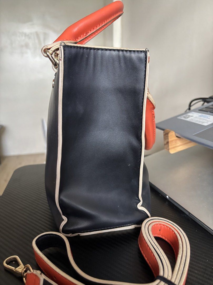Marithé + François Girbaud Black & Orange Rectangular Bag (Category: Tote Bags) located in Manila. Submitted by noble.rafael (Listing ID 1469182187, Image 3). Description: Marithé + François Girbaud Black & Orange Rectangular Bag 🖤🧡 Pre-loved bag with a strap. Heavily used and has visible signs of wear due to usage. Still functional and can be used for everyday styling. Please manage your expectations regarding its condition..
