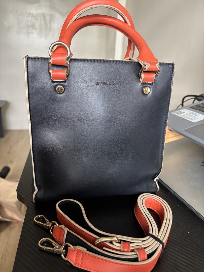 Marithé + François Girbaud Black & Orange Rectangular Bag (Category: Tote Bags) located in Manila. Submitted by noble.rafael (Listing ID 1469182187, Image 2). Description: Marithé + François Girbaud Black & Orange Rectangular Bag 🖤🧡 Pre-loved bag with a strap. Heavily used and has visible signs of wear due to usage. Still functional and can be used for everyday styling. Please manage your expectations regarding its condition..