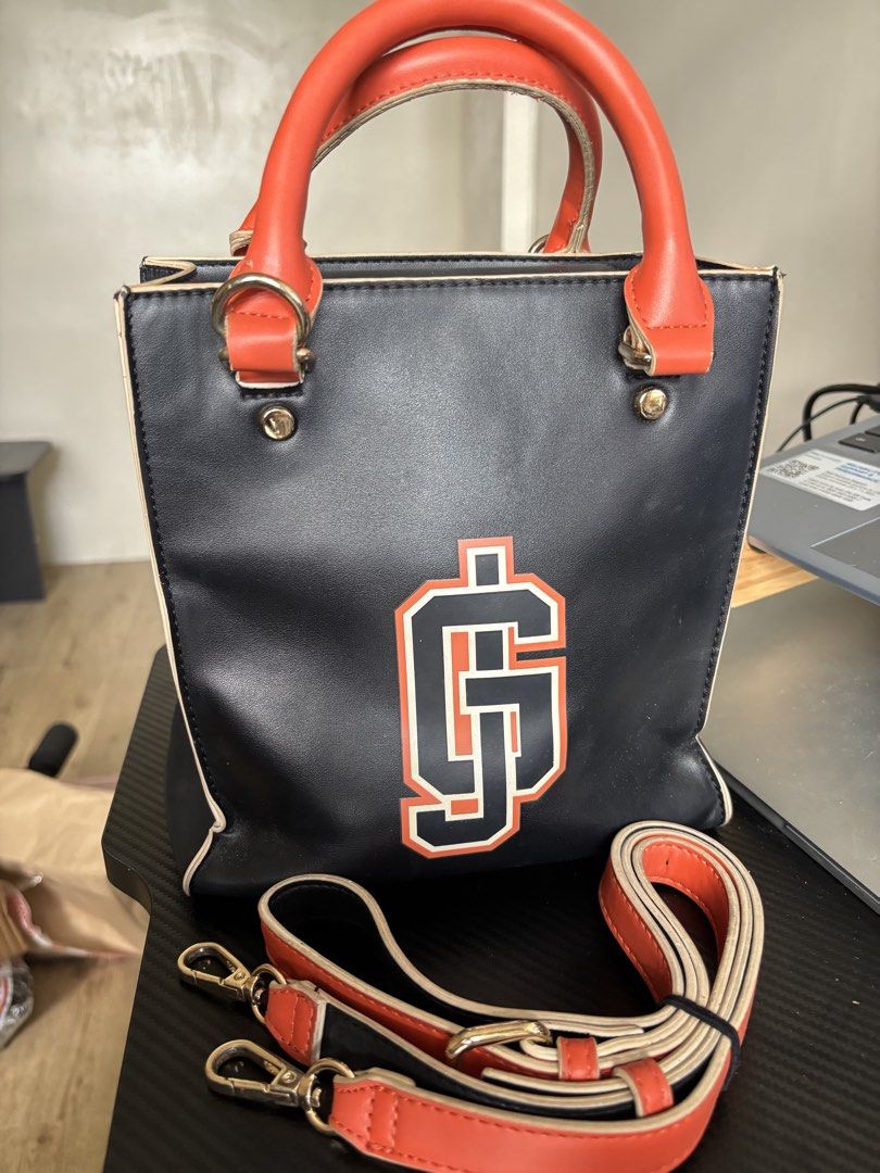Marithé + François Girbaud Black & Orange Rectangular Bag (Category: Tote Bags) located in Manila. Submitted by noble.rafael (Listing ID 1469182187, Image 1). Description: Marithé + François Girbaud Black & Orange Rectangular Bag 🖤🧡 Pre-loved bag with a strap. Heavily used and has visible signs of wear due to usage. Still functional and can be used for everyday styling. Please manage your expectations regarding its condition..