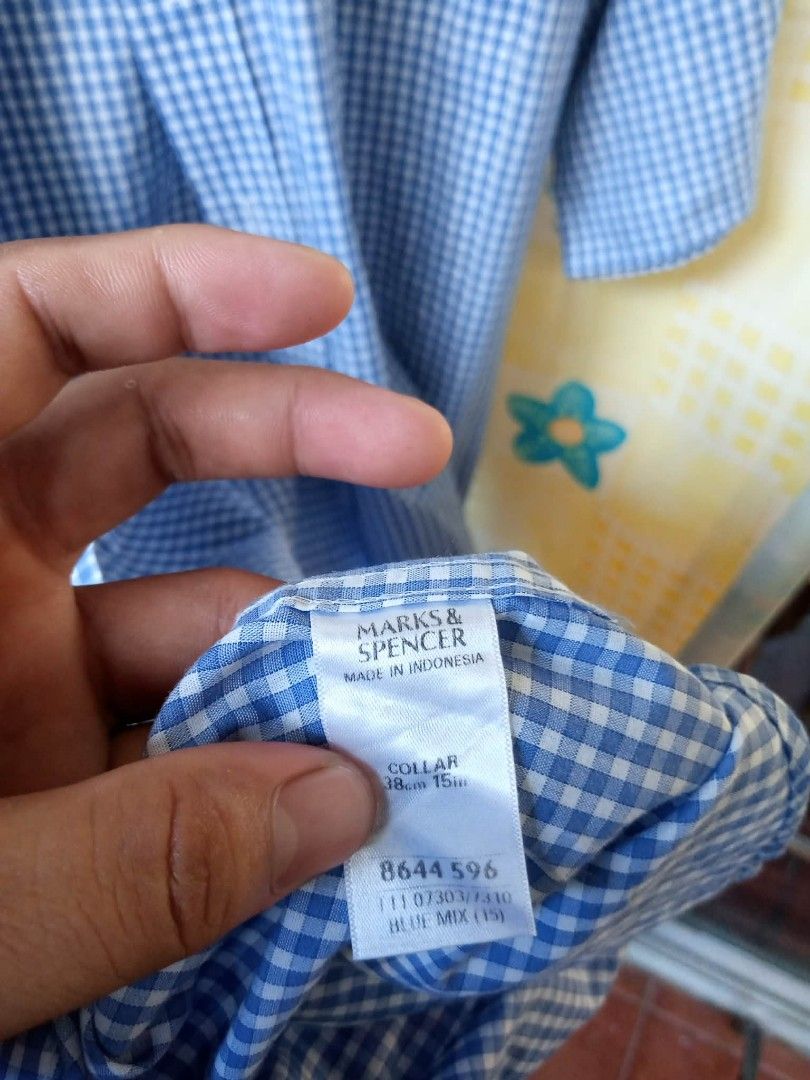 MARKS SPENCER Blue Gingham Checkered Short Sleeve Shirt (Category: Formal Shirts) located in Pasig City. Submitted by rjkfindsofficial (Listing ID 1469175766, Image 3). Description: ITEM DETAILS & SPECS: • Brand: MARKS & SPENCER (Tailoring Line) • Pattern / Color: Gingham Checkered / Blue Mix & White • Feature: Non-Iron / Wrinkle-Resistant Fabric • Material: 55% Cotton, 45% Polyester • Tag Size: Collar 38cm / 15in (Fits Men's Small to Slim Medium