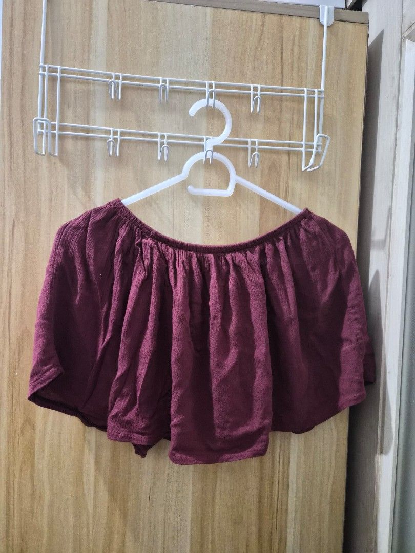 Maroon Off-Shoulder Ruffle Jumpsuit (Category: Jumpsuits) located in Mandaluyong City. Submitted by joyce1593 (Listing ID 1469254869, Image 1). Description: - Style: Off-shoulder jumpsuit with layered ruffle top - Bottoms: Flowy wide-leg pants - Fit: Comfortable elastic neckline and waistband for easy slip-on - Color: Solid wine red / maroon - Fabric: Soft and smooth material - Occasion: Versatile for casual days or night outs.