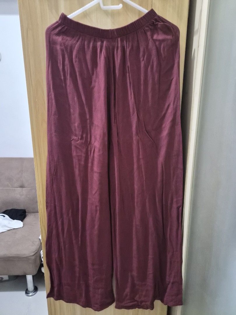 Maroon Off-Shoulder Ruffle Jumpsuit (Category: Jumpsuits) located in Mandaluyong City. Submitted by joyce1593 (Listing ID 1469254869, Image 2). Description: - Style: Off-shoulder jumpsuit with layered ruffle top - Bottoms: Flowy wide-leg pants - Fit: Comfortable elastic neckline and waistband for easy slip-on - Color: Solid wine red / maroon - Fabric: Soft and smooth material - Occasion: Versatile for casual days or night outs.