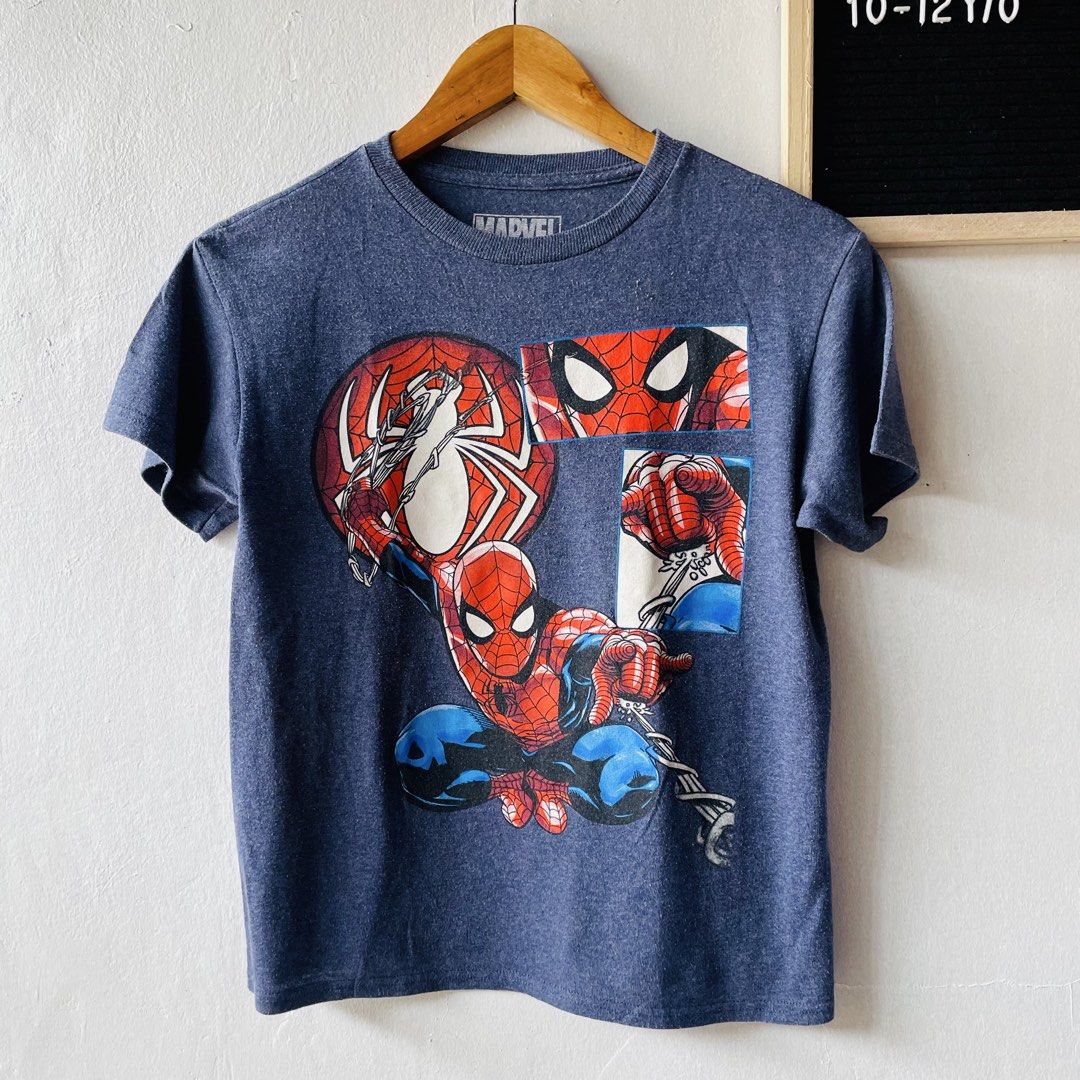 Marvel Spider-Man Comic Print T-Shir (Category: Babies & Kids Fashion) located in Caloocan City. Submitted by lovemyclothes21 (Listing ID 1469263308, Image 2). Description: - Design: Marvel Spider-Man comic book panel graphic print - Color: Heather blue - Size: LG (Fits 10-12 years old) - Material: Comfortable cotton and polyester blend - Style: Crew neck, short sleeves - Origin: Made in Honduras - Condition: Brand new / Excellent quality.
