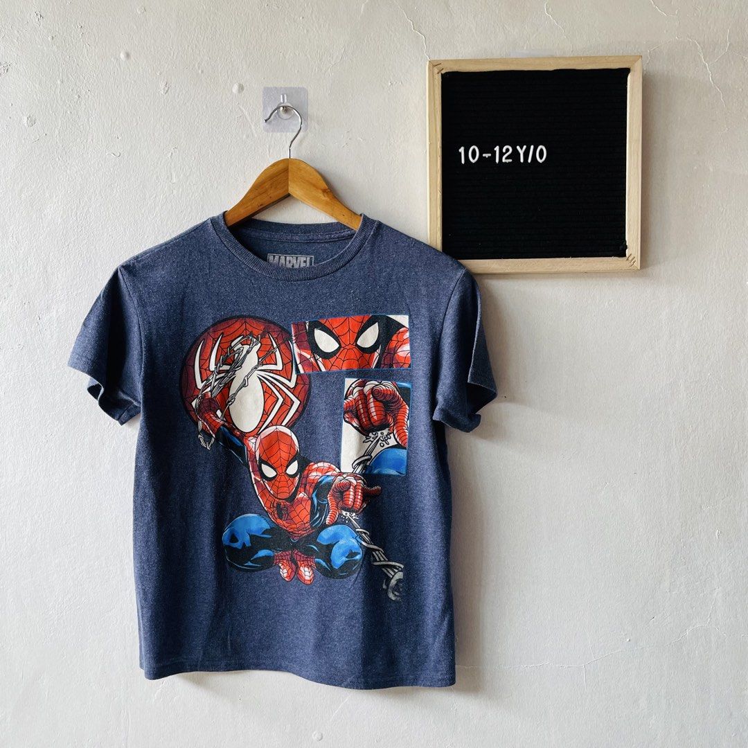 Marvel Spider-Man Comic Print T-Shir (Category: Babies & Kids Fashion) located in Caloocan City. Submitted by lovemyclothes21 (Listing ID 1469263308, Image 1). Description: - Design: Marvel Spider-Man comic book panel graphic print - Color: Heather blue - Size: LG (Fits 10-12 years old) - Material: Comfortable cotton and polyester blend - Style: Crew neck, short sleeves - Origin: Made in Honduras - Condition: Brand new / Excellent quality.