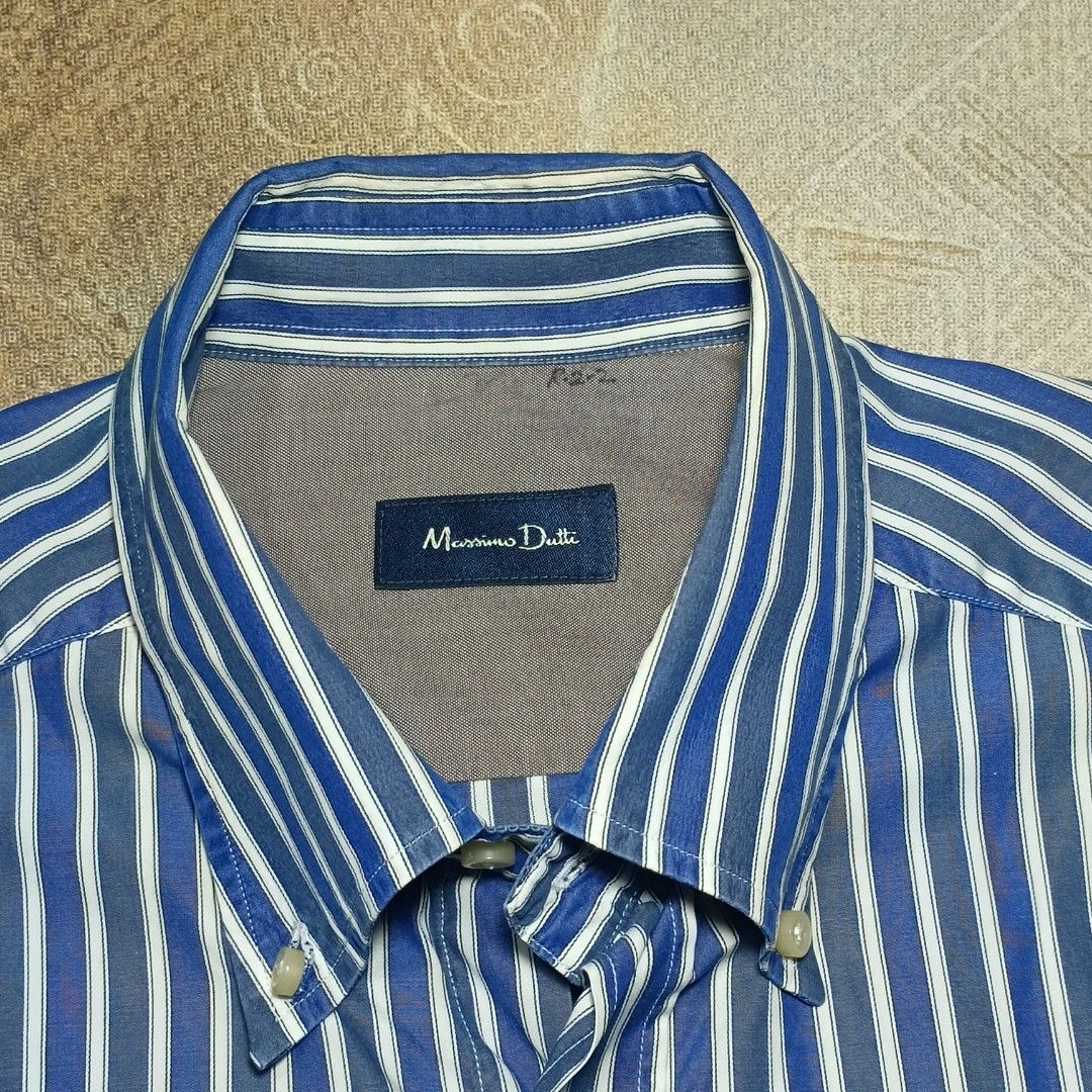 Massimo Dutti Blue and White Striped Long Sleeve Button-Down Shirt (Category: Longsleeves) located in Cavite. Submitted by navias (Listing ID 1469338430, Image 2). Description: Origin:UAE 100% authentic slightly negotiable - Brand: Massimo Dutti - Design: Blue and white vertical stripes - Fit: Classic fit - Details: Long sleeves, button cuffs, button-down collar, and contrast inner collar/placket - Condition/Style: Clean look, versatile for both 