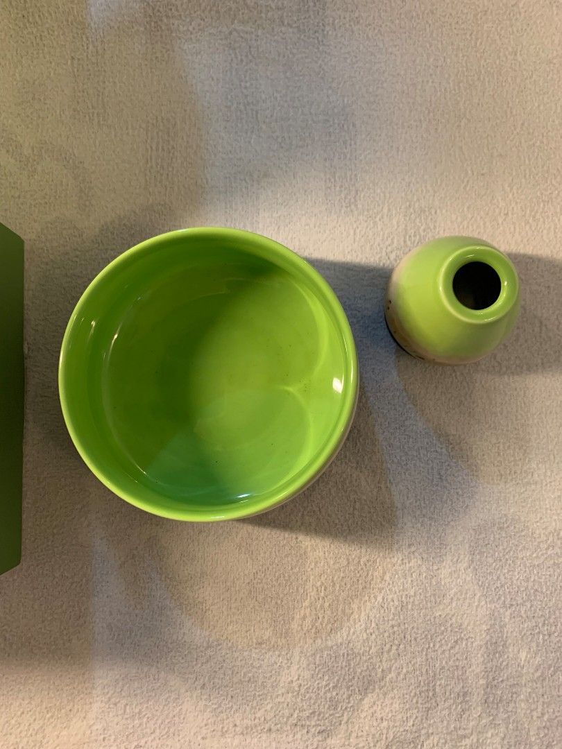 Matcha Tea Set Green Ceramic Bowl and Holder (Category: Coffee & Tea Tableware) located in Baguio. Submitted by grazia.ivy (Listing ID 1469301427, Image 3). Description: - Brand new green matcha tea set in original packaging box - Includes a handcrafted ceramic bowl and a matching small holder - Features a striking, vibrant lime green glaze on the inside - Designed with a stylish natural earthy gradient finish on the outside - 100% unused and in 
