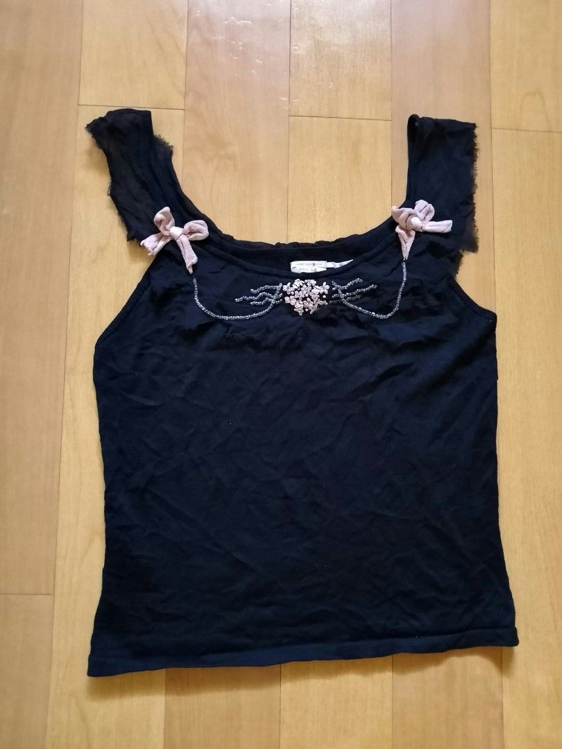 Max Studio 100% Silk Tank Top Size M (Category: Sleeveless) located in Cabuyao City. Submitted by love.gie (Listing ID 1469298434, Image 1). Description: Max Studio black silk tank top in size medium. Features a scoop neckline with bead, sequin, and fabric flower details, plus cute pink knit bows and ruffled trim. -Siza: Medium -No flaw Price: 150 +sf.