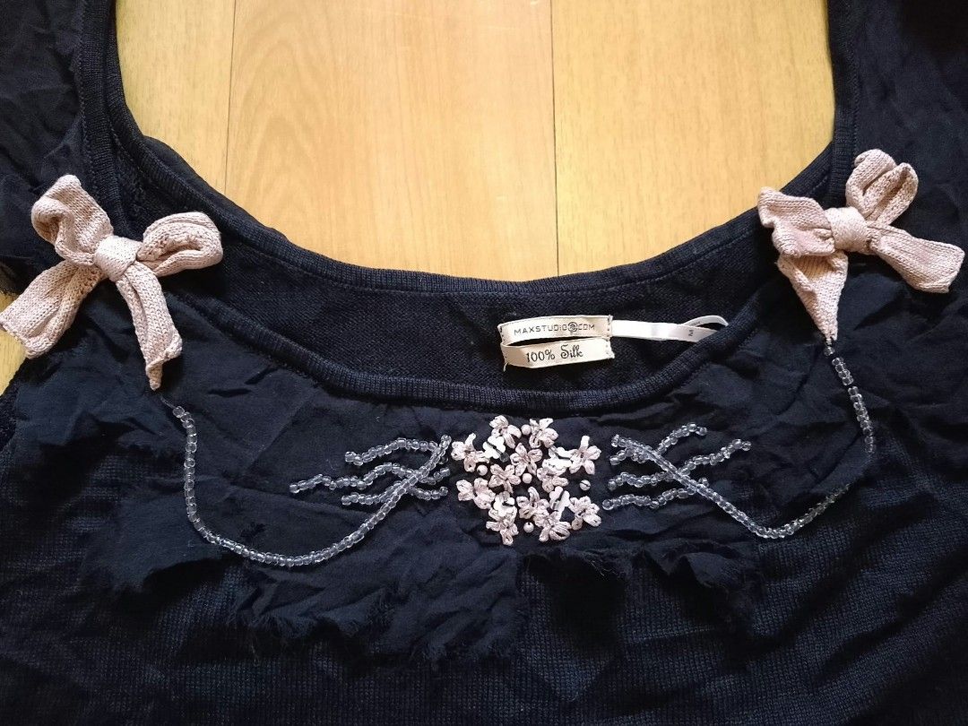 Max Studio 100% Silk Tank Top Size M (Category: Sleeveless) located in Cabuyao City. Submitted by love.gie (Listing ID 1469298434, Image 2). Description: Max Studio black silk tank top in size medium. Features a scoop neckline with bead, sequin, and fabric flower details, plus cute pink knit bows and ruffled trim. -Siza: Medium -No flaw Price: 150 +sf.