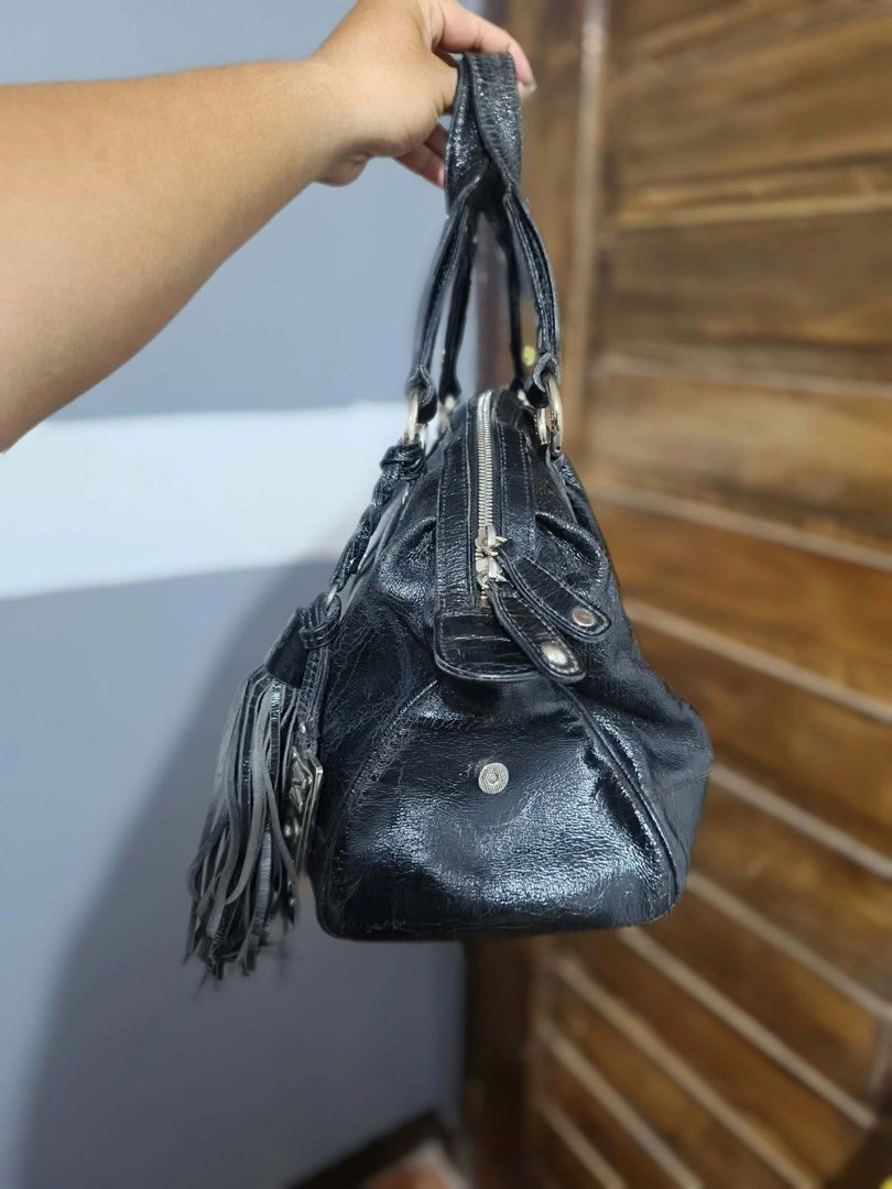 MCM Black Leather Bag (Category: Shoulder Bags) located in Alaminos. Submitted by thriftings625 (Listing ID 1469170097, Image 2). Description: Medium size fit bignotebook and Ipad Interior clean & spacious Zippers & hardware working well Pre-loved condition: signs of use, slight wear on edges & leather no major damage 📍 Alaminos, Pangasinan.