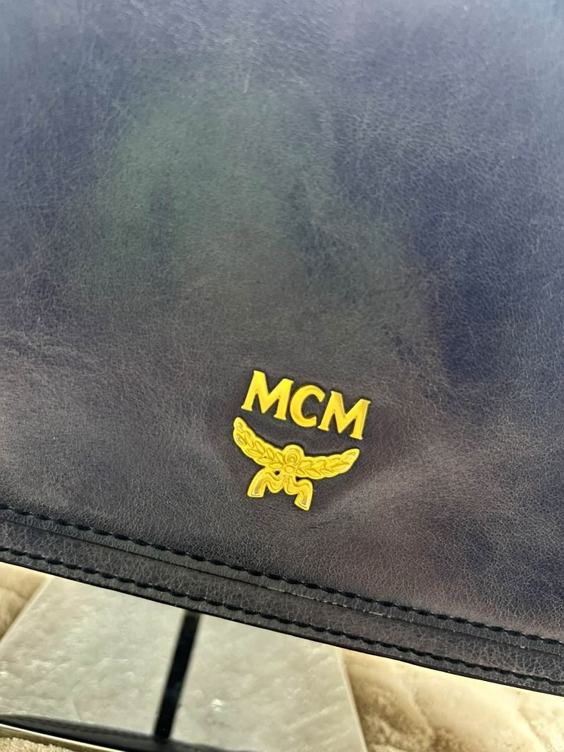 MCM BLUE DISTRESS LEATHER HAND BAG WITH SLING (Category: Cross-body Bags) located in Caloocan City. Submitted by j3ngsanity (Listing ID 1469301270, Image 2). Description: ISSUE : MIN SIGN OF USAGE ONLY YKK ZIP / CODED.
