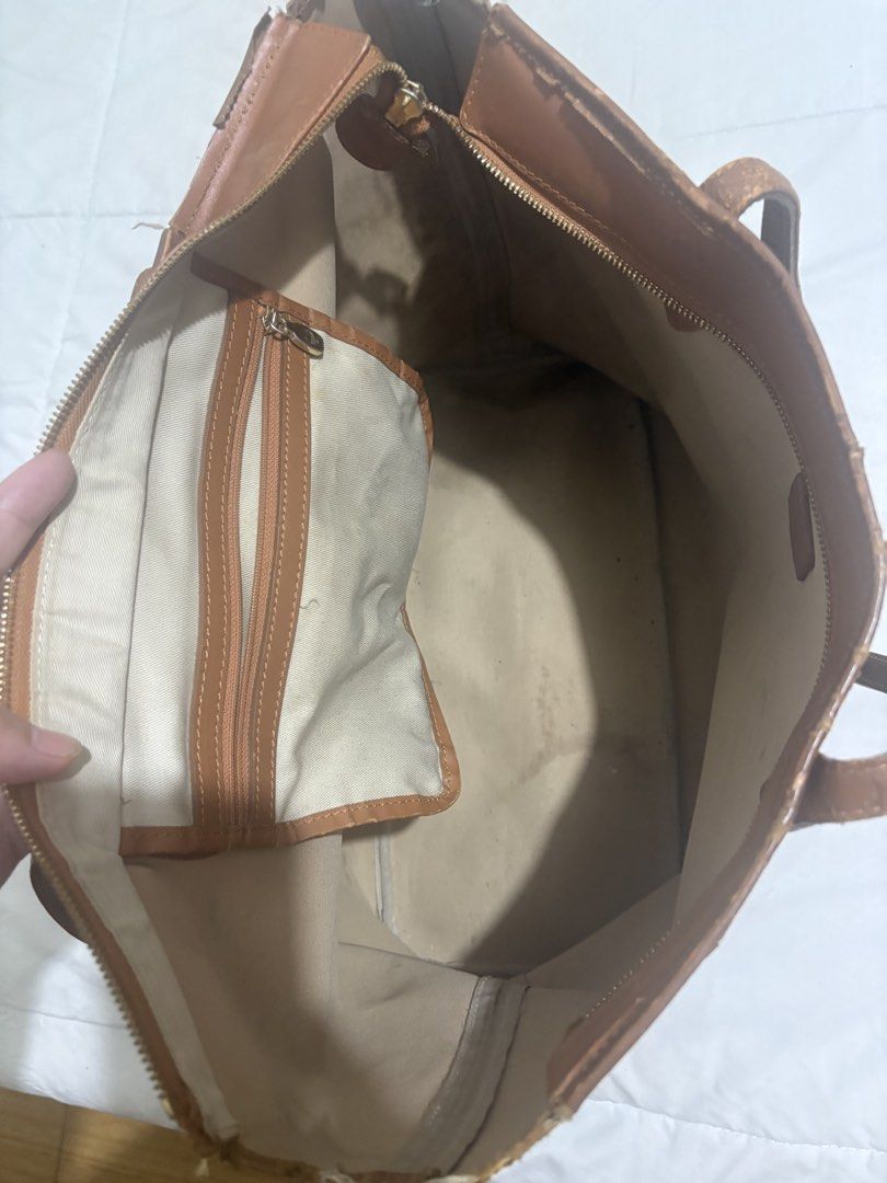 MCM Visetos Monogram Tote Bag Brown (Category: Luxury Bags & Wallets) located in Manila. Submitted by nykji96 (Listing ID 1469191086, Image 2). Description: - Authentic MCM brown monogram tote bag - Tan leather handles with gold-tone hardware - Includes a charming bone charm on a beaded chain - Secure zip top closure - Fabric-lined interior with a convenient zippered pocket - Condition note: Visible signs of wear along the top edges, base corners