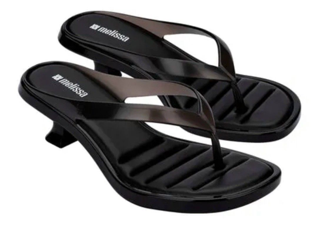 Melissa Black Thong Kitten Heel Sandals (Category: Flats & Sandals) located in Manila. Submitted by msdhabz0325 (Listing ID 1469222394, Image 1). Description: - Brand: Melissa (Made in Brazil) - Style: Black thong sandals with a chic kitten heel - Design: Trendy transparent strap and comfortable ribbed footbed for extra grip - Condition: Tried on once, practically untouched (like new). Not used at all - Packaging: Comes with original box and pape