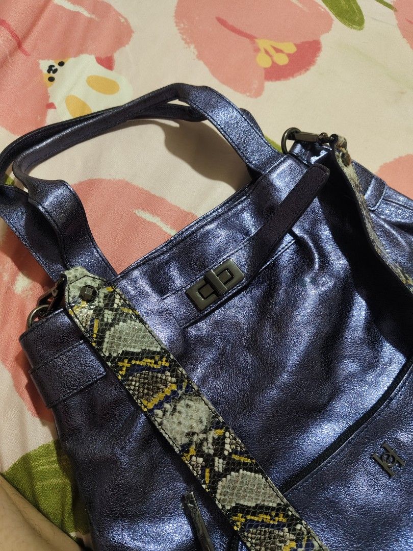 Metallic Blue Shoulder Bag With Snake Print Strap (Category: Shoulder Bags) located in Quezon City. Submitted by gorgeousvixen051893 (Listing ID 1469339038, Image 3). Description: - Color: Metallic blue with green and yellow snake print strap - Style: Slouchy everyday tote bag - Straps: Double top handles and detachable snake print shoulder strap - Closure: Twist lock on front flap - Hardware: Dark-toned metal - Interior: Includes handy zip pocke