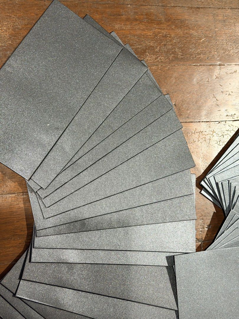Metallic silver/black cardstock envelope (Category: Craft Supplies & Tools) located in San Juan City. Submitted by nicaceli (Listing ID 1469324935, Image 2). Description: - Color: Metallic silver/black with a sparkling finish - Quantity: 41 pieces in a neat stack - Condition: Clean edges, flat, and ready to use (previously used for a wedding) - Ideal for invitations, special events, and craft projects - Some has signs of usage, others have not be