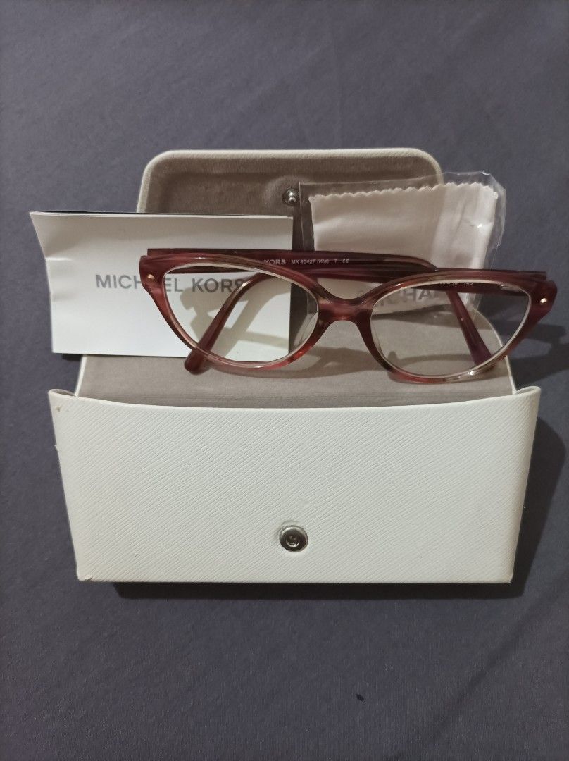 Michael Kors Cat-eye Eyeglasses with Case (Category: Sunglasses & Eyewear) located in Quezon City. Submitted by 90sradar (Listing ID 1469243359, Image 1). Description: Michael Kors Cat-eyes with case 2000 - Tortoise Shell, never used complete with pamphlet and branded microfiber cloth 1500 - Black, lightly used Both cases have signs of ware. .