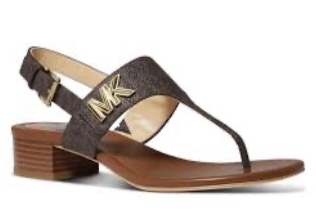 Michael Kors MK Logo Low Block Heel Sandals (Category: Flats & Sandals) located in Makati City. Submitted by silentfox_6a5d2c (Listing ID 1469242606, Image 2). Description: - 100% Authentic Michael Kors signature MK logo sandals - Comfortable low block heel for all-day wear - Chic thong-style strap with adjustable slingback buckle closure - Available in 2 gorgeous colors: Brown Monogram (Dark Soles) or Vanilla Monogram (White Soles) - Includes or