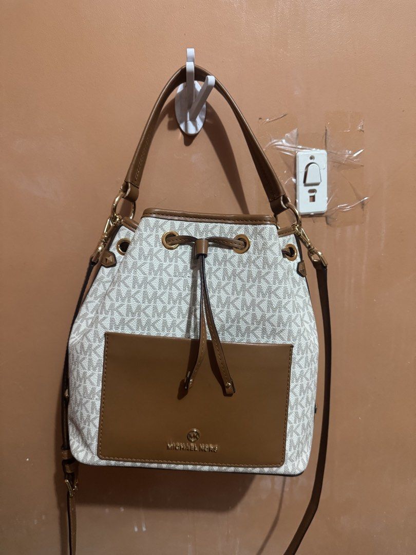 Michael Kors MK monogram canvas bucket bag brown white (Category: Luxury Bags & Wallets) located in Dasmarinas. Submitted by rinz0man (Listing ID 1469305043, Image 2). Description: - Authentic Michael Kors bucket bag in signature MK monogram canvas with stylish white and brown panels - Elegant gold-tone hardware and front slip pocket with metal logo lettering - Secure drawstring top closure with a spacious interior for your daily essentials - Inc