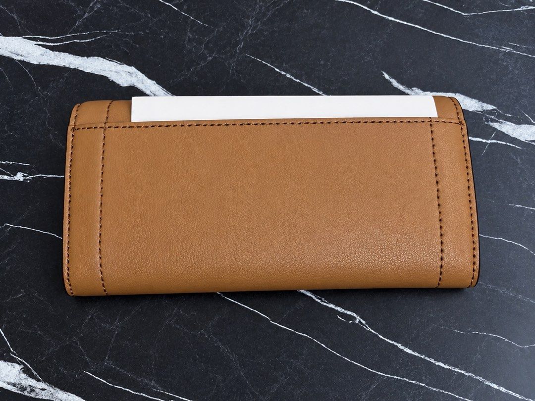 Michael Kors MK original long wallet (Category: Wallets & Card holders) located in Manila. Submitted by viancakes09 (Listing ID 1469194557, Image 3). Description: Brand new Original With tag Color: brown.