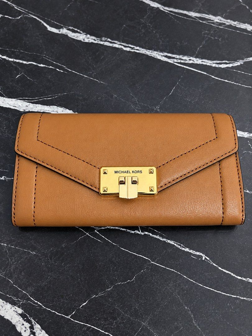 Michael Kors MK original long wallet (Category: Wallets & Card holders) located in Manila. Submitted by viancakes09 (Listing ID 1469194557, Image 1). Description: Brand new Original With tag Color: brown.