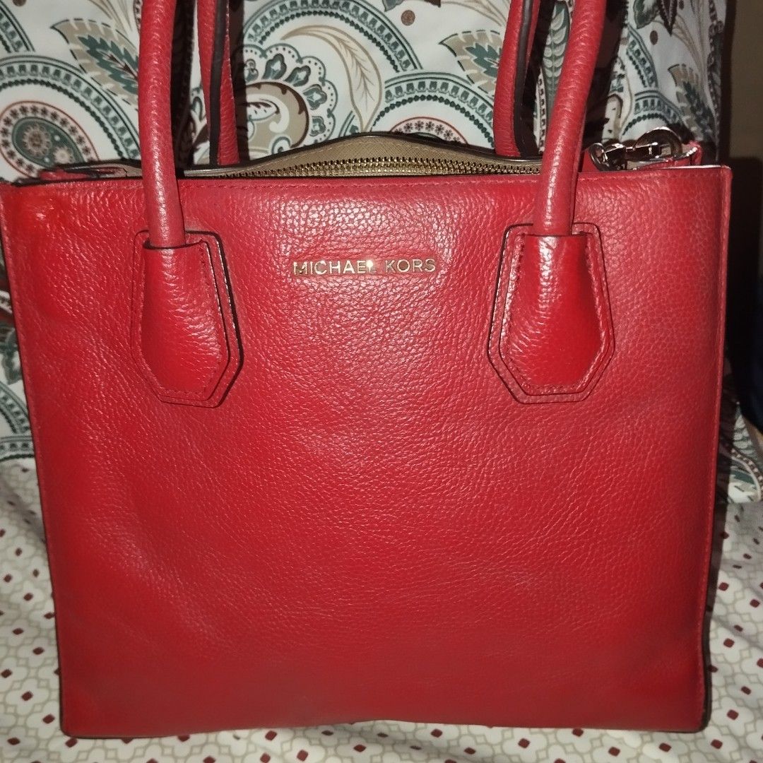 Michael Kors Red Leather Tote Bag (Category: Tote Bags) located in Manila. Submitted by lene48 (Listing ID 1469239982, Image 1). Description: - Brand: Michael Kors - Color: Bright Red - Material: Genuine pebbled leather - Hardware: Gold-toned stamping and accents - Closure: Secure zip-top closure - Interior: Fabric-lined with a convenient zip pocket - Protection: Bottom feet to protect the base - Condition: Excellent, well-maintained - Mode of Pa