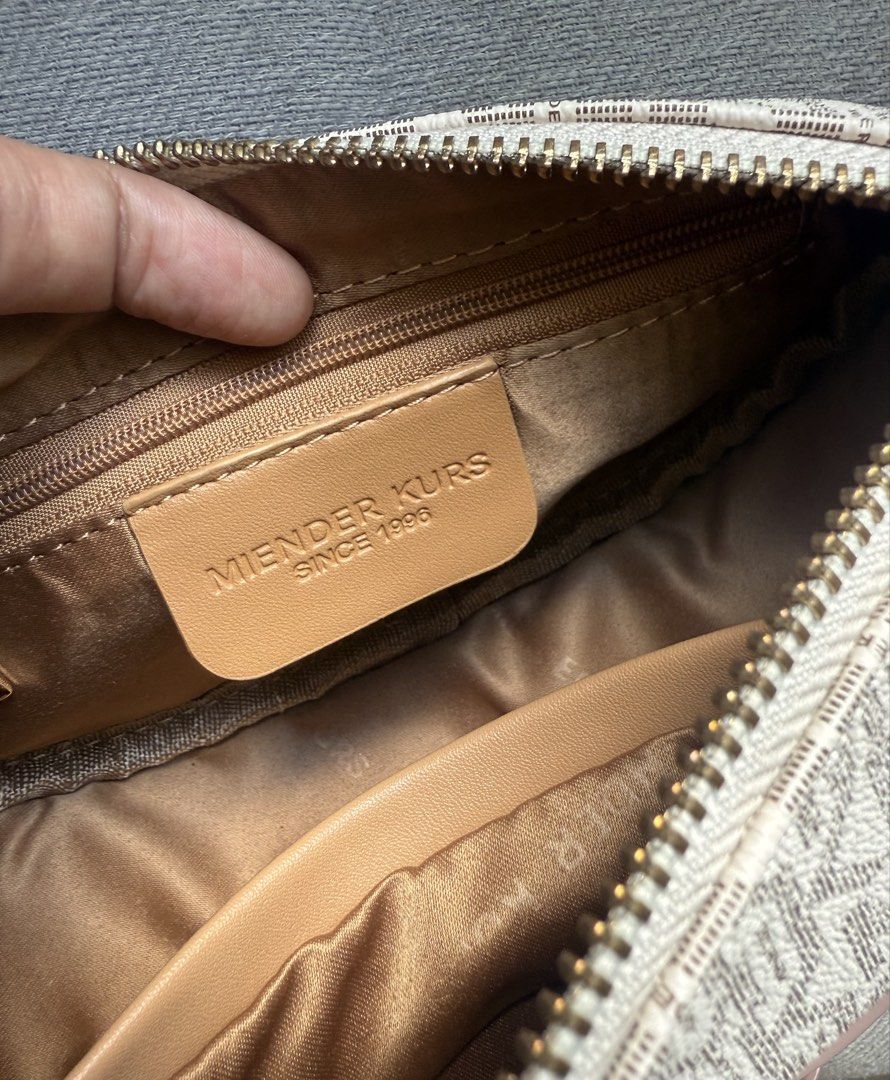 Miender Kurs Monogram Crossbody Bag Pink (Category: Cross-body Bags) located in Cebu City. Submitted by decluttereverythingcebu (Listing ID 1469179924, Image 3). Description: USED ONCE BY MY DAUGHTER (She doesnt like it) Brand: MIENDER KUR - Pink and white monogram crossbody bag - Secure top zip closure with chic gold-tone hardware - Brown fabric-lined interior featuring one zipper pocket and one open pocket - Super clean inside and out, practica