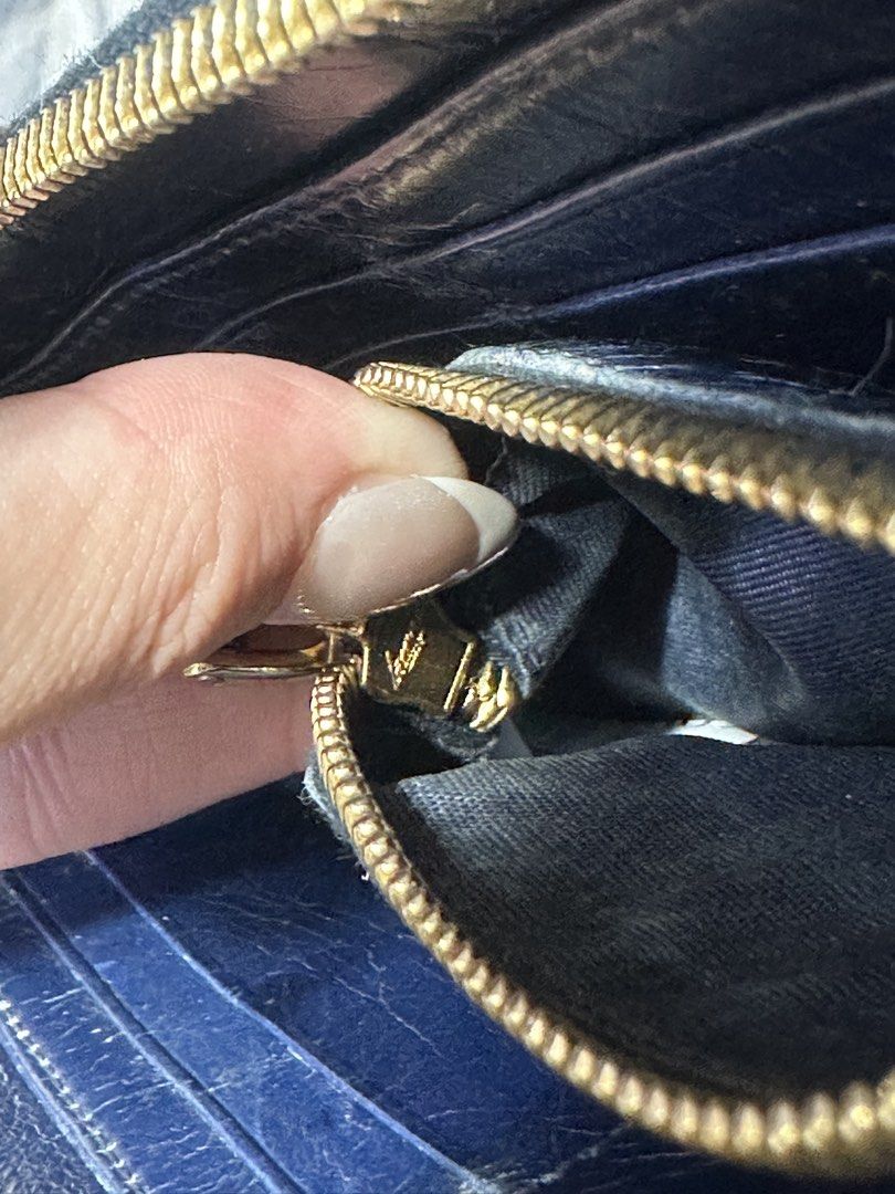 Miu Miu Black Quilted Leather Long Wallet (Category: Luxury Bags & Wallets) located in Baguio. Submitted by nicolesy.co (Listing ID 1469390797, Image 3). Description: - Brand: Miu Miu - Material: Black quilted leather with gold-tone hardware and lettering - Closure: Secure zip-around with smooth zipper action - Interior: Fabric lining, multiple card slots, and a zippered coin compartment - Condition: Normal wear on the leather and edges from regu